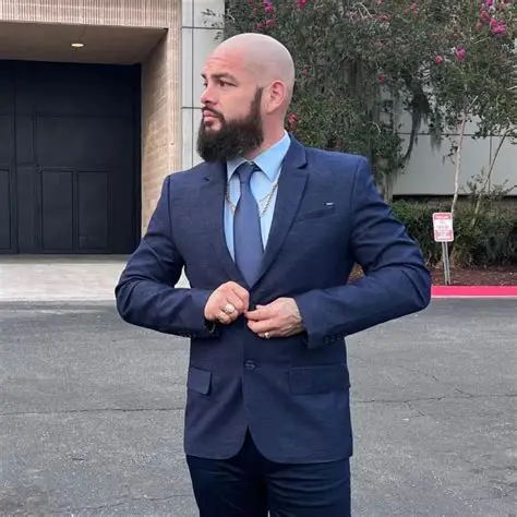 Isaiah Hinojosa — Houston TX Real Estate Agent in professional navy suit